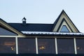 Attic skylight window wall. Building Modern House Construction with metal roof, rain gutter system and roof protection from snow Royalty Free Stock Photo