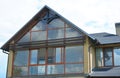 Attic skylight window wall. Modern new house with panoramic window,