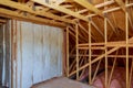 Attic with foam insulation frame house in process of construction Royalty Free Stock Photo