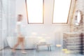 Attic white bathroom interior, sink and tub, woman Royalty Free Stock Photo