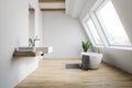 Attic white bathroom interior, tub and sink Royalty Free Stock Photo