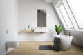 Attic white bathroom with toilet Royalty Free Stock Photo