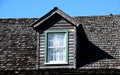 Attic window in tiled roof Royalty Free Stock Photo