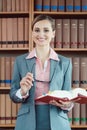 Attorney at law in her office in front of book shelf Royalty Free Stock Photo