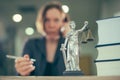 Attorney woman talking on mobile phone from her office desk Royalty Free Stock Photo