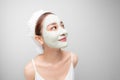 Attraactive young Asian woman with a face clay mask against acne on the face of a woman to rejuvenate the skin