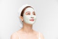 Attraactive young Asian woman with a face clay mask against acne on the face of a woman to rejuvenate the skin