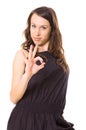 Attracive woman in black showing ok sign