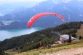 St. Gilgen, Austria: The red paraglider begins its flight over the mountains Royalty Free Stock Photo