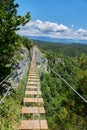 Attraction in the rocks, a walk along the stairs over a deep abyss.