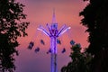 The attraction spinning carousel on a high tower