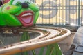 Attraction type roller coaster near the caterpillar caterpillar. Royalty Free Stock Photo