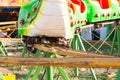 Attraction type roller coaster near the caterpillar . Royalty Free Stock Photo