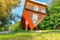 Attraction Upside down house, a house that stands on the roof, a funny house upside down in a park, upside-down Royalty Free Stock Photo