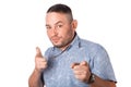 Attractive adult man with stubble in summer shirt shows a finger in your face Royalty Free Stock Photo