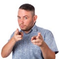 Attractive adult man with stubble in summer shirt shows a finger in your face on an isolated Royalty Free Stock Photo