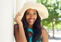 Attractive african american woman smiling with sun hat Royalty Free Stock Photo