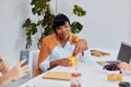 Attractive african business lady during break time on work place