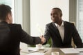 Attractive african businessman and caucasian business partner ha Royalty Free Stock Photo