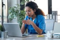 Attractive afro female doctor talking while explaining medical treatment to patient through a video call with laptop in the