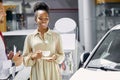 Attractive afro woman enjoy being owner of new auto Royalty Free Stock Photo
