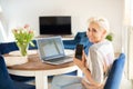 Attractive age woman working in home office Royalty Free Stock Photo