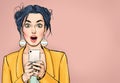 Attractive amazed young woman  with mobile phone in hand. Wow girl in comic style. Pop art woman holding smartphone. Royalty Free Stock Photo