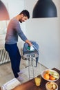 American black man is ironing shirt at home Royalty Free Stock Photo