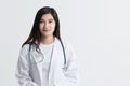 Attractive Asian female doctor looking at camera with smiling face,  on white background with copy space. studio shot Royalty Free Stock Photo