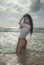 An attractive asian model on the beach on a sunny day Royalty Free Stock Photo