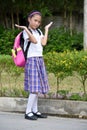 Undecided Diverse Female Student Wearing Uniform With Notebooks Royalty Free Stock Photo