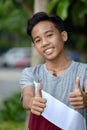 Youthful Filipino Boy With Thumbs Up