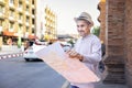 attractive asian senior pensioner with grey hair and beard,older adult man tourist wearing hat,standing at the crossroads Royalty Free Stock Photo