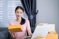 Attractive asian teenage start up running small business owner from home office. Home business concept Royalty Free Stock Photo