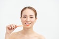 Attractive asian woman brushing teeth on white background Royalty Free Stock Photo