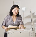 Attractive asian woman making copy. Royalty Free Stock Photo