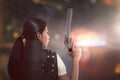 Attractive asian woman police with uniform with a guns Royalty Free Stock Photo