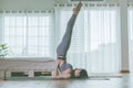 Attractive Asian woman practice yoga in bedroom after wake up in the morning Royalty Free Stock Photo