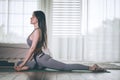 Attractive Asian woman practice yoga in bedroom after wake up in the morning Royalty Free Stock Photo