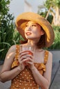 Attractive asian woman relaxing and drinking in the park Royalty Free Stock Photo