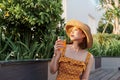 Attractive asian woman relaxing and drinking in the park Royalty Free Stock Photo