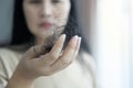 Attractive Asian woman serious about her hair and presentation hair loss problem Royalty Free Stock Photo