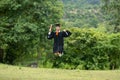 Attractive Asian Women Student Graduate in cap and gown celebrating jump with certificate in hand and so proud happiness