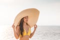 Attractive Asian young woman wearing yellow bikini smile enjoy with summer vacation on the beach feeling so happiness Royalty Free Stock Photo