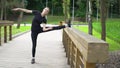 Attractive athletic girl doing exercises for stretching legs. Slow motion