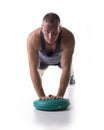 Attractive athletic young man working out with balance board Royalty Free Stock Photo