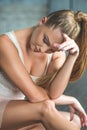 Attractive ballet dancer sitting on floor Royalty Free Stock Photo