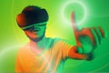 Attractive bearded man trying VR headset and poniting in lightning circle. Young man exploring another world with