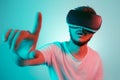 Attractive bearded man trying VR headset and poniting. Young man exploring another world with virtual reality goggles on