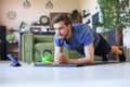 Attractive beared man doing plank exercise at home during quarantine. Fitness is the key to health Royalty Free Stock Photo